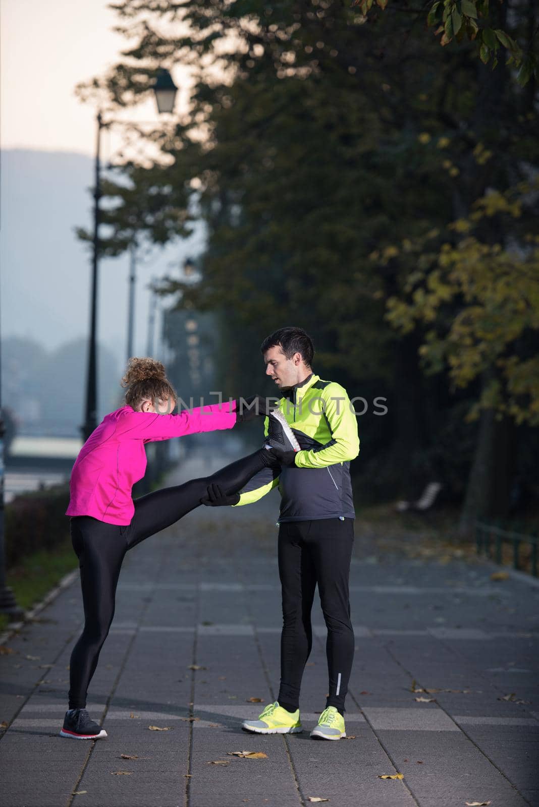 couple warming up before jogging by dotshock