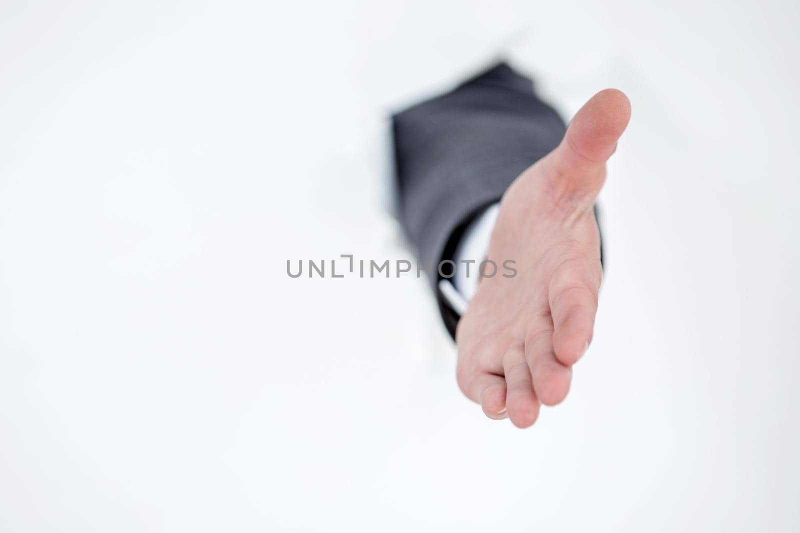 businessman holding out his hand for a handshake . photo with copy space