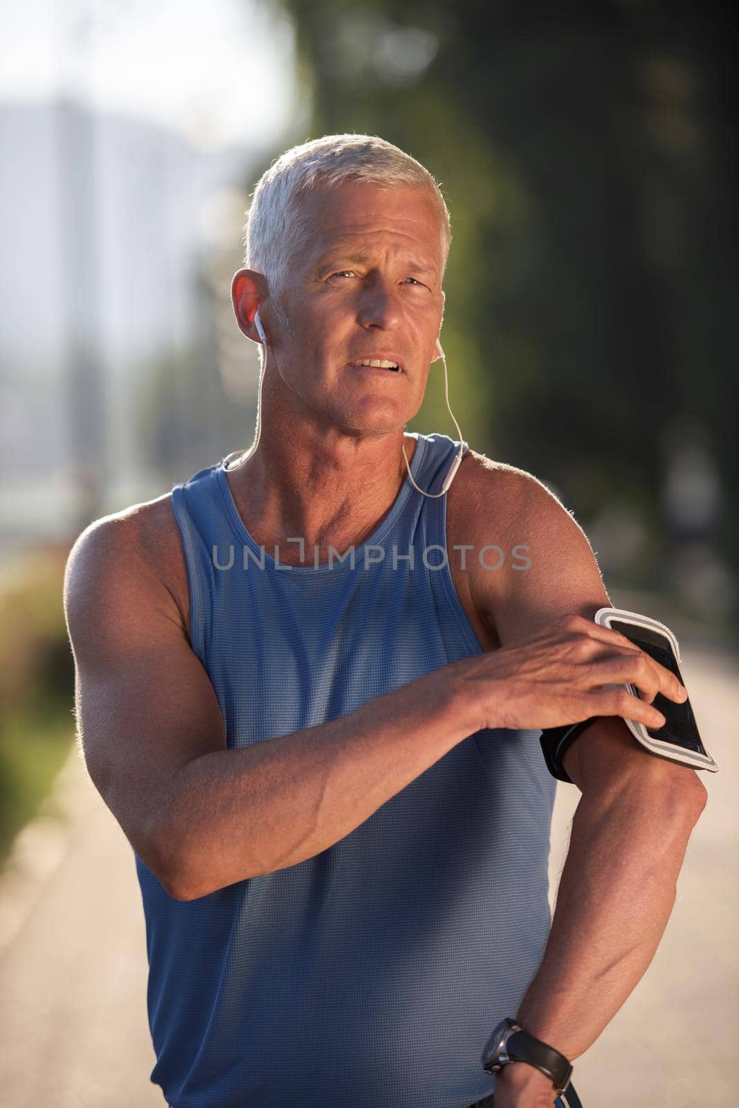 portrait of handsome senior jogging man by dotshock