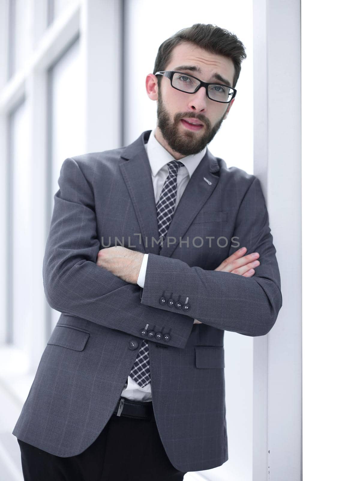 close up.smiling businessman standing in the office by asdf