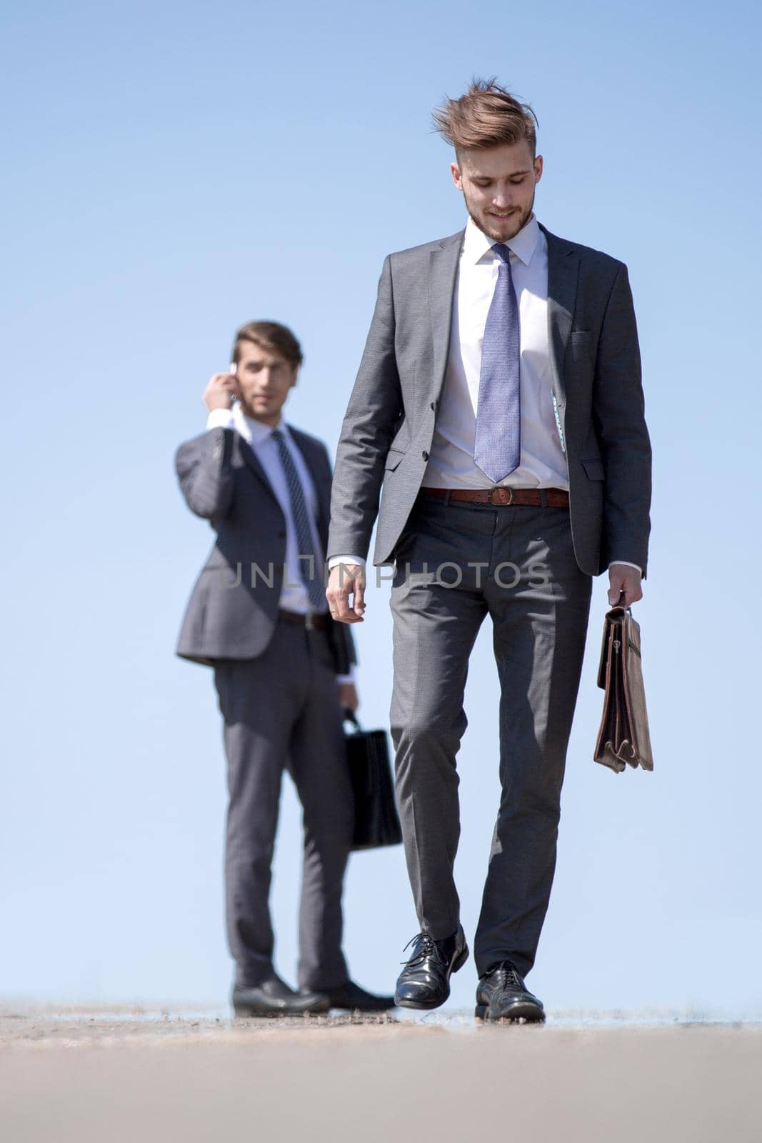 business people using smartphones on the street.photo with copy space