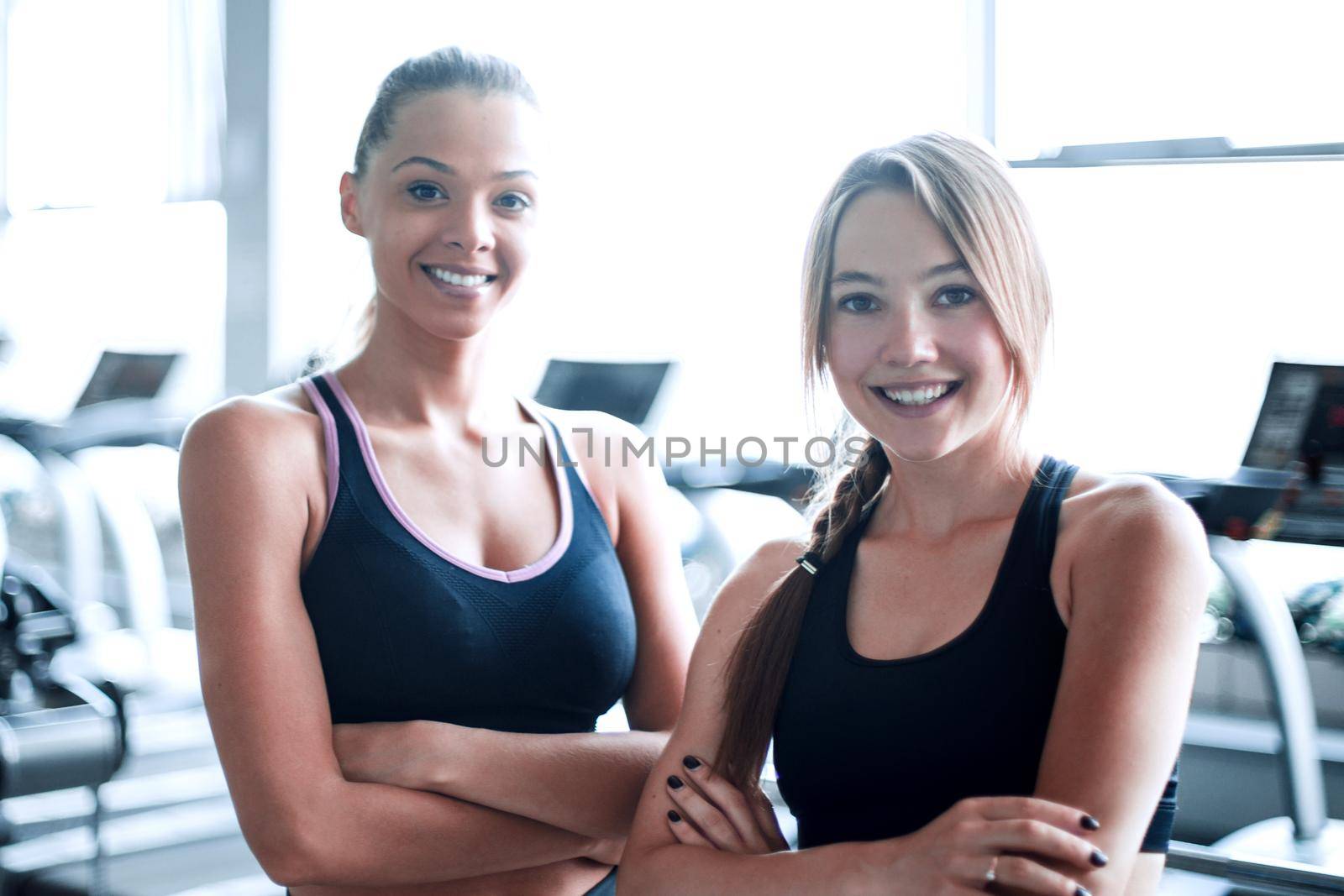 two young woman on the background of the gym.healthy lifestyle