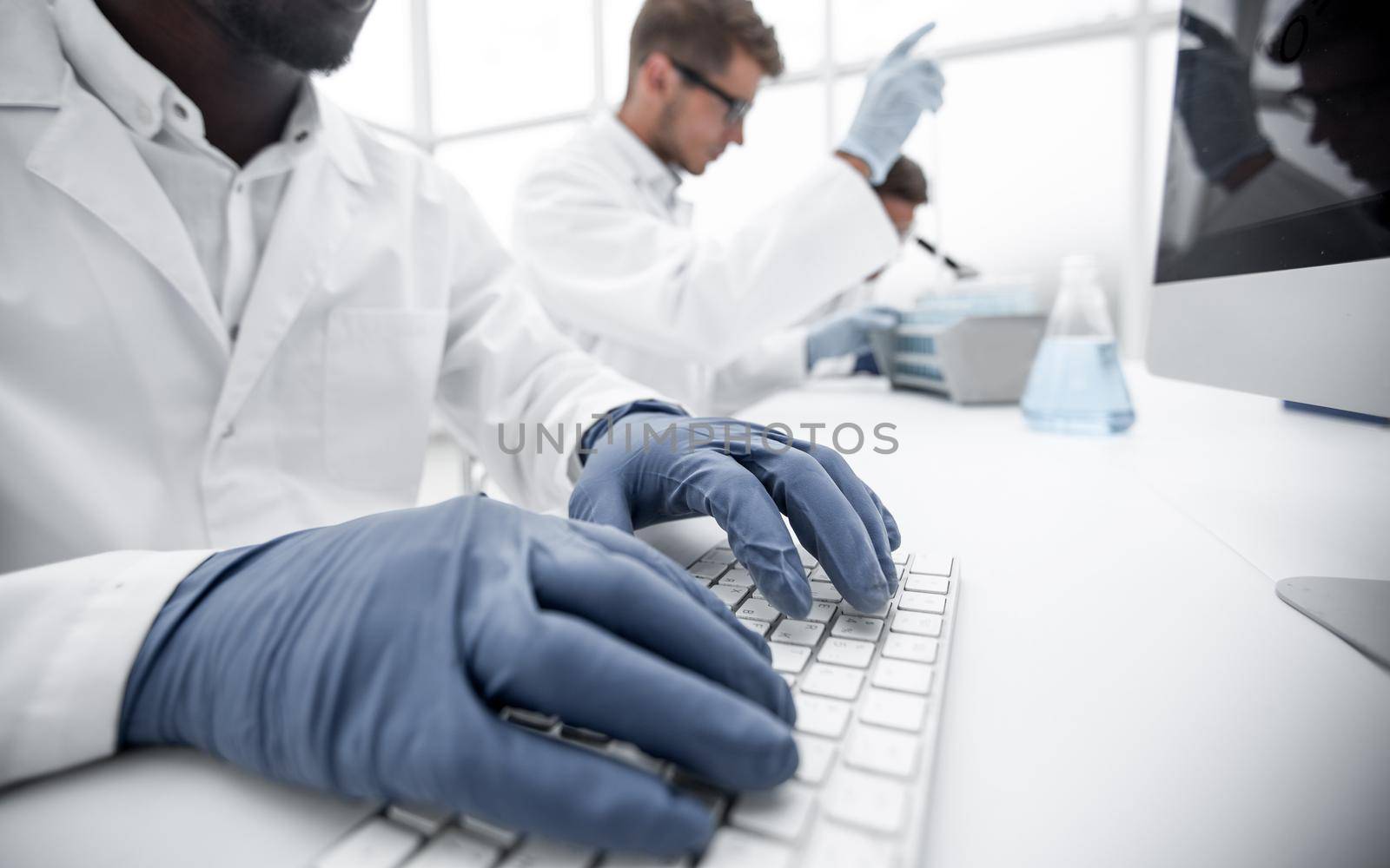 close up.scientist typing on computer keyboard.science and technology