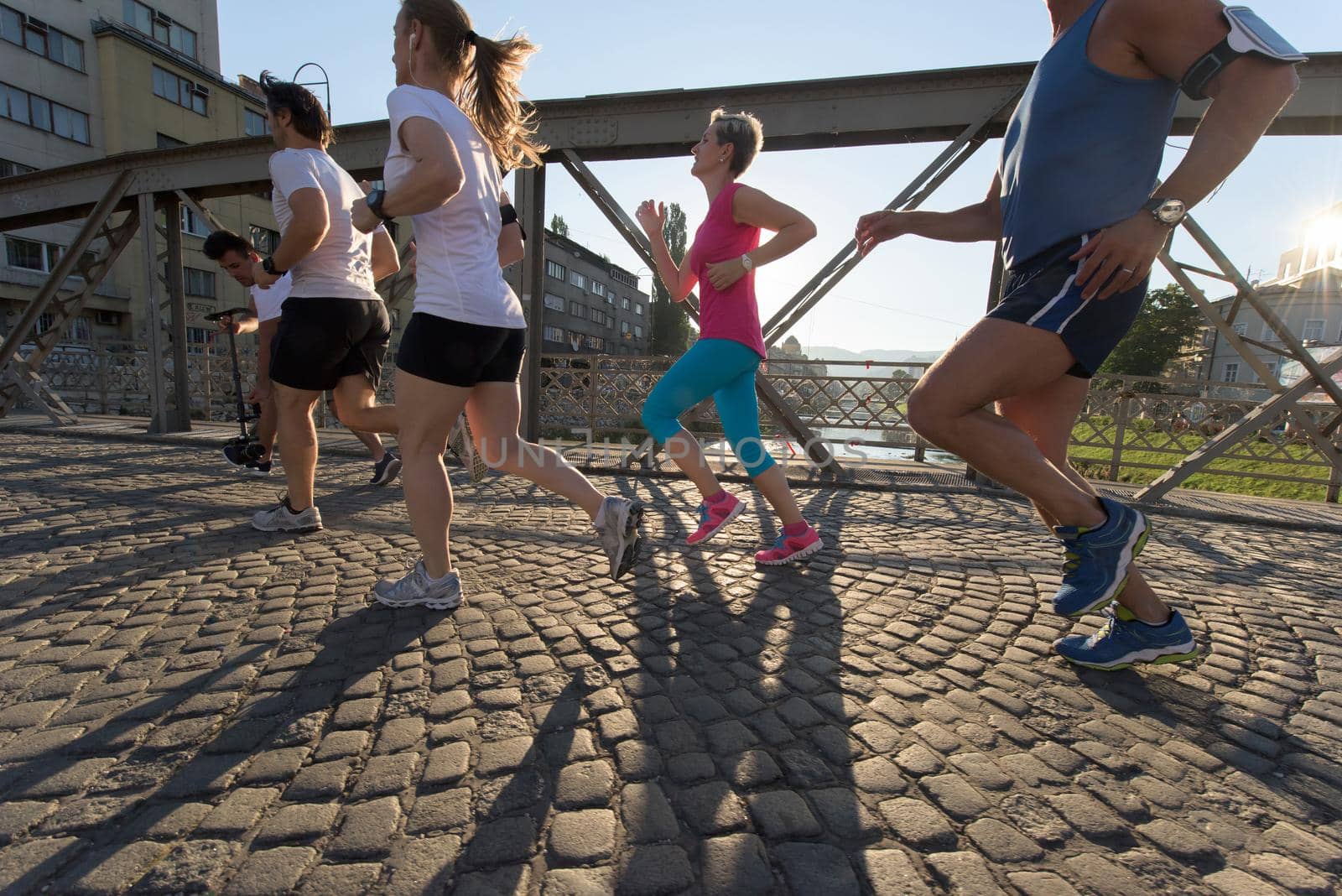 people group jogging  runners team on morning  training workout with sunrise in background