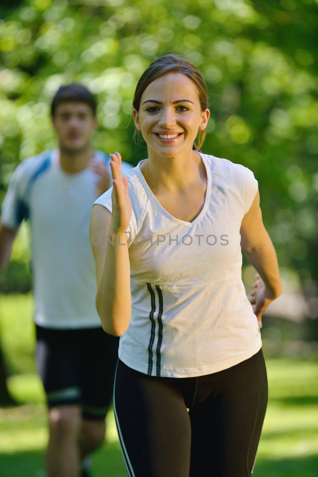Young couple jogging by dotshock