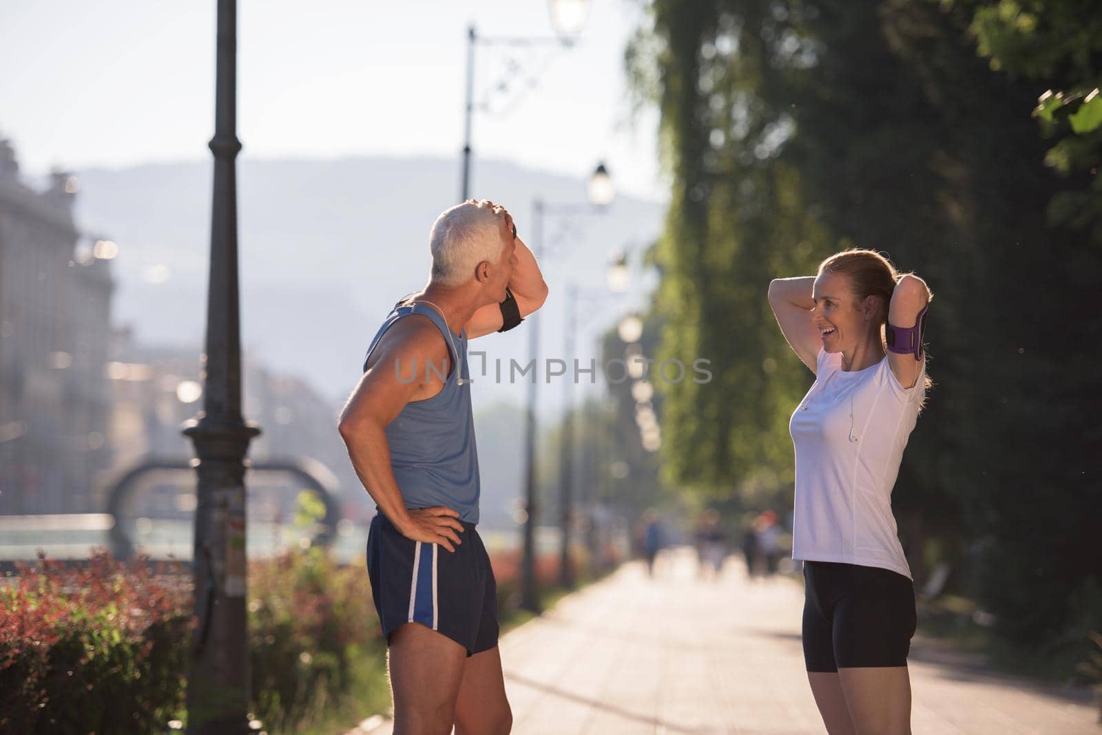 jogging couple planning running route  and setting music by dotshock