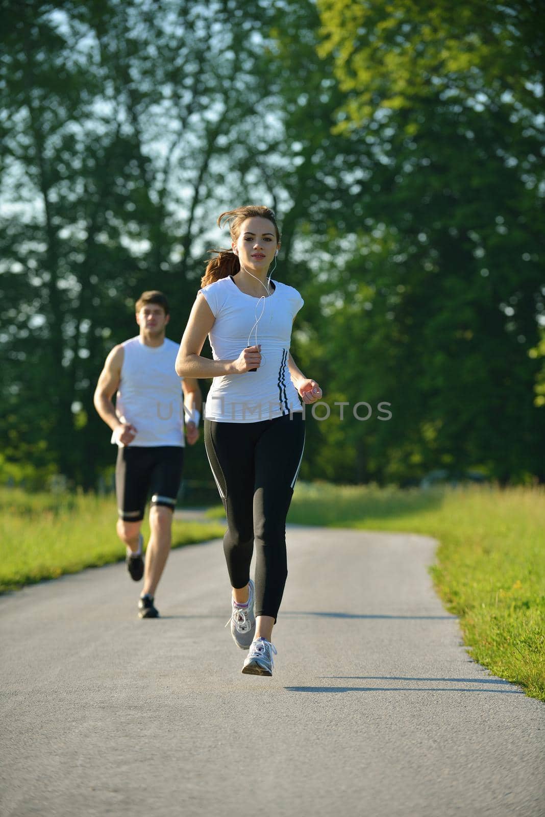 Young couple jogging by dotshock