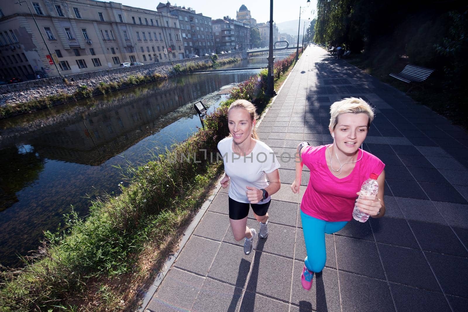 female friends jogging by dotshock