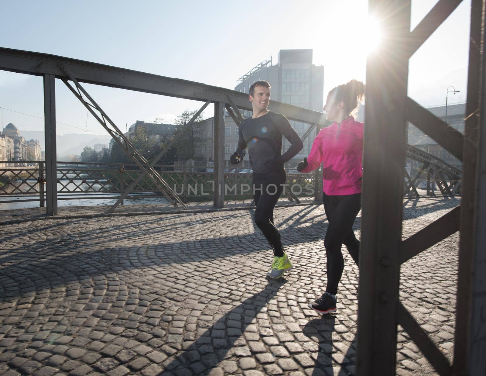 young  couple jogging by dotshock