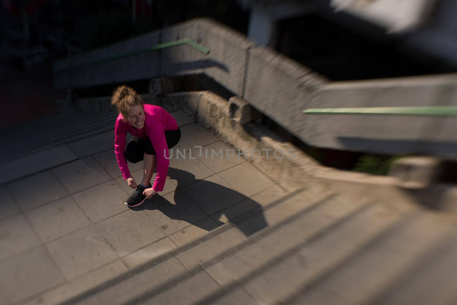 woman  stretching before morning jogging by dotshock