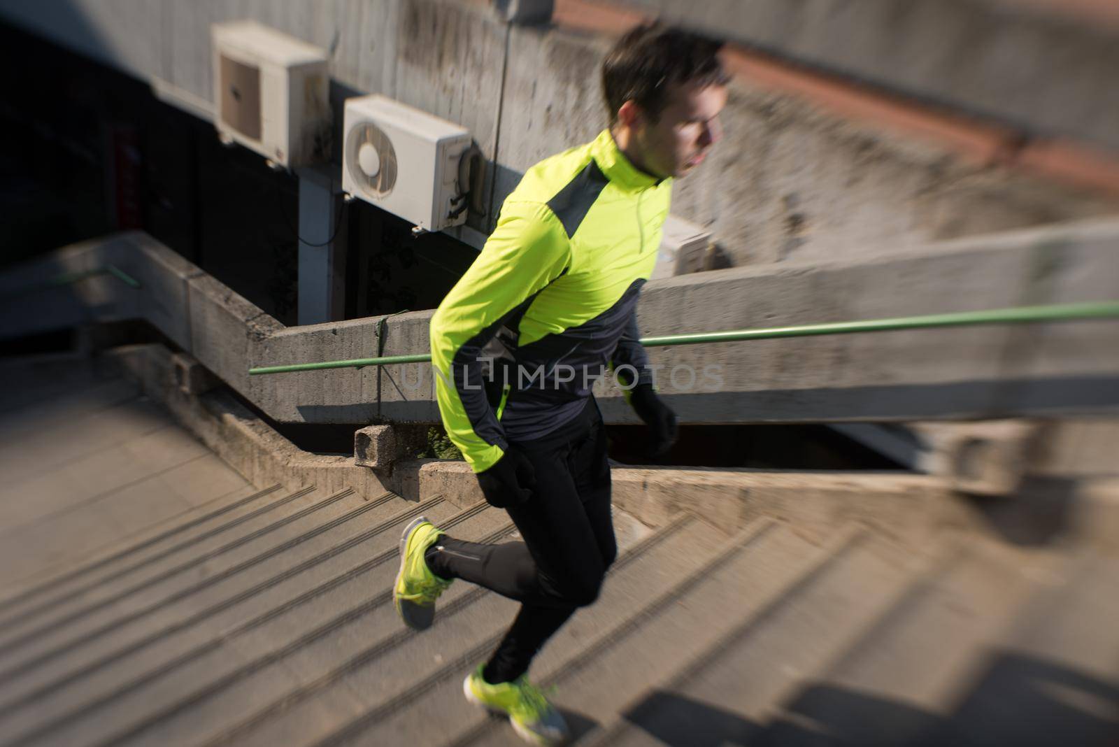 man jogging on steps by dotshock