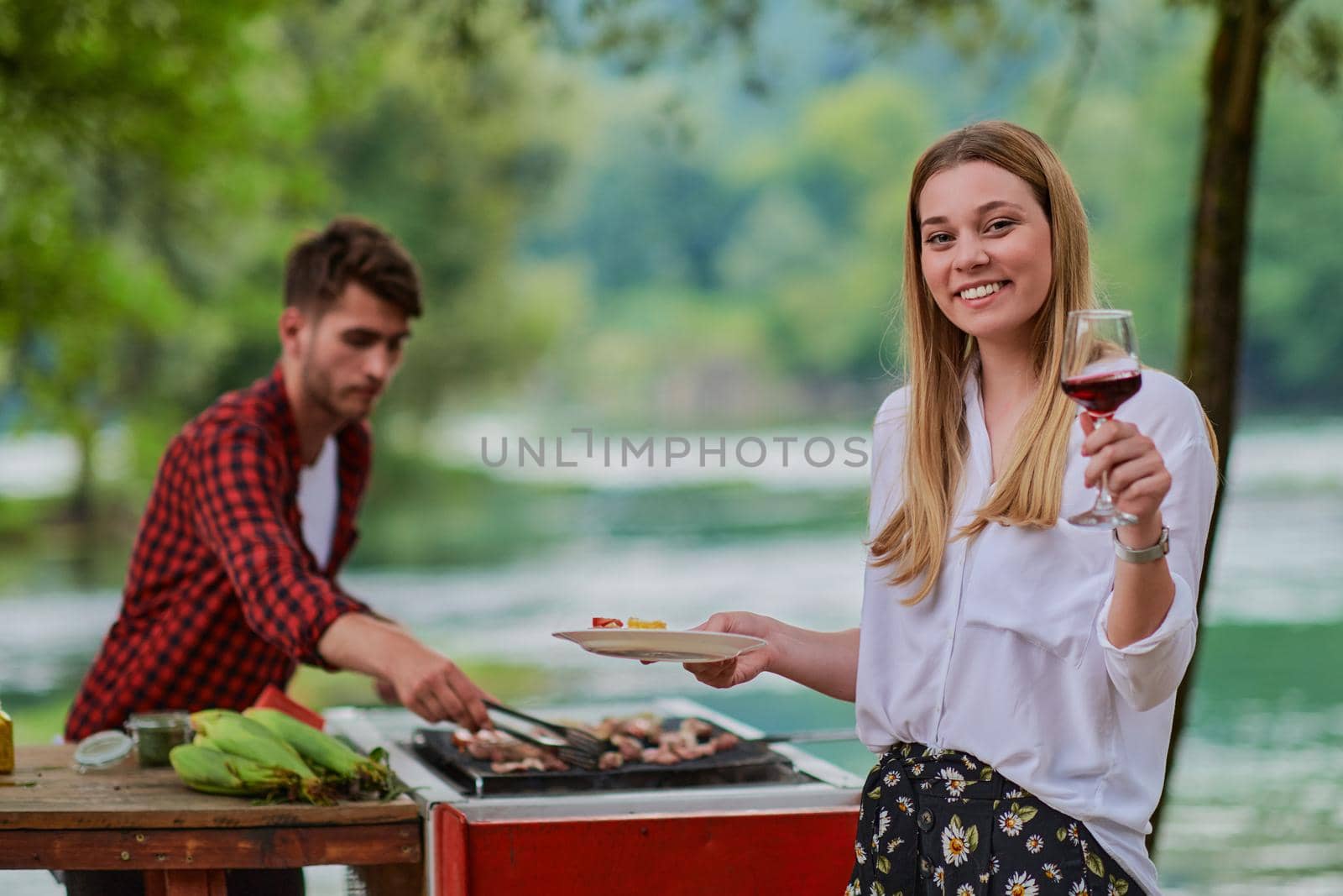 friends having picnic french dinner party outdoor during summer holiday by dotshock