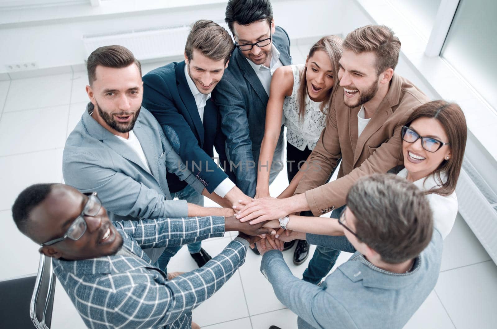 close up.modern business team standing in a circle by asdf