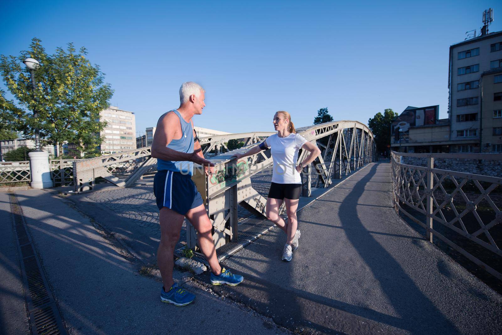 jogging couple planning running route  and setting music by dotshock