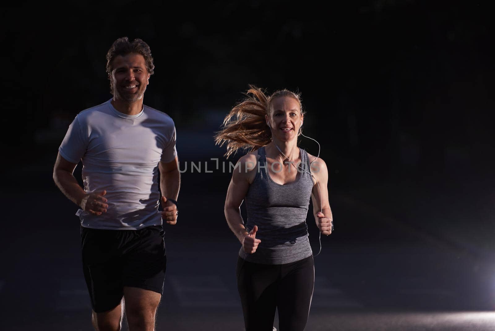 couple jogging at early morning by dotshock