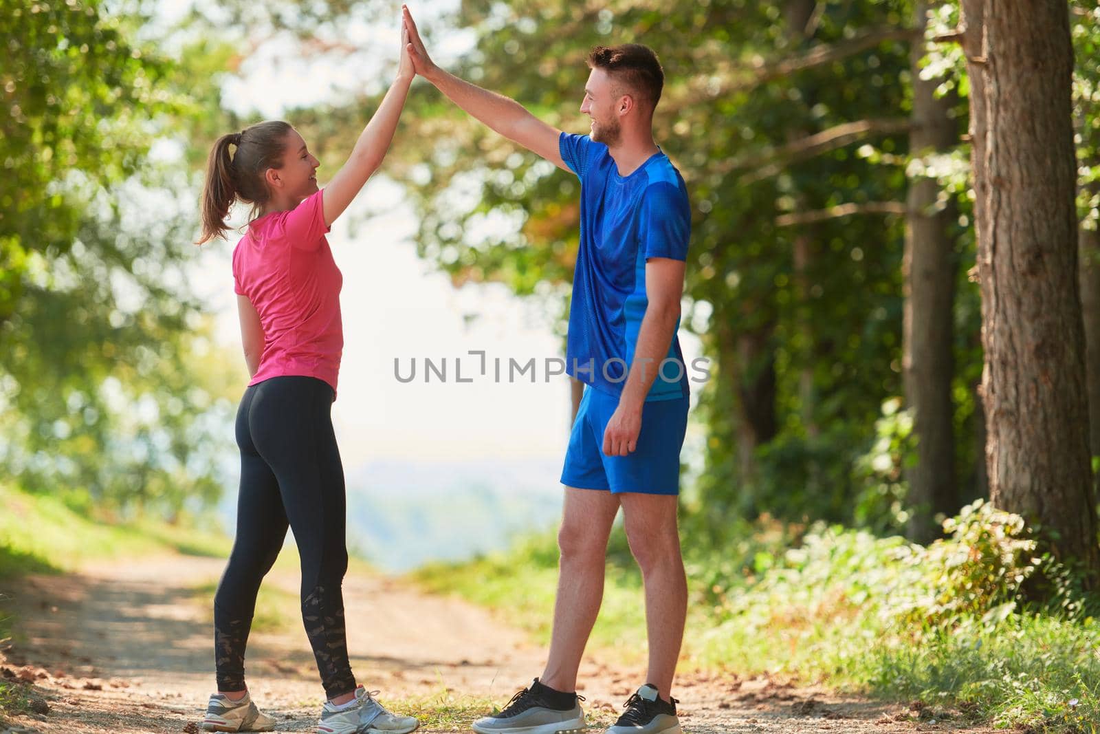 young couple preparing for a morning run by dotshock