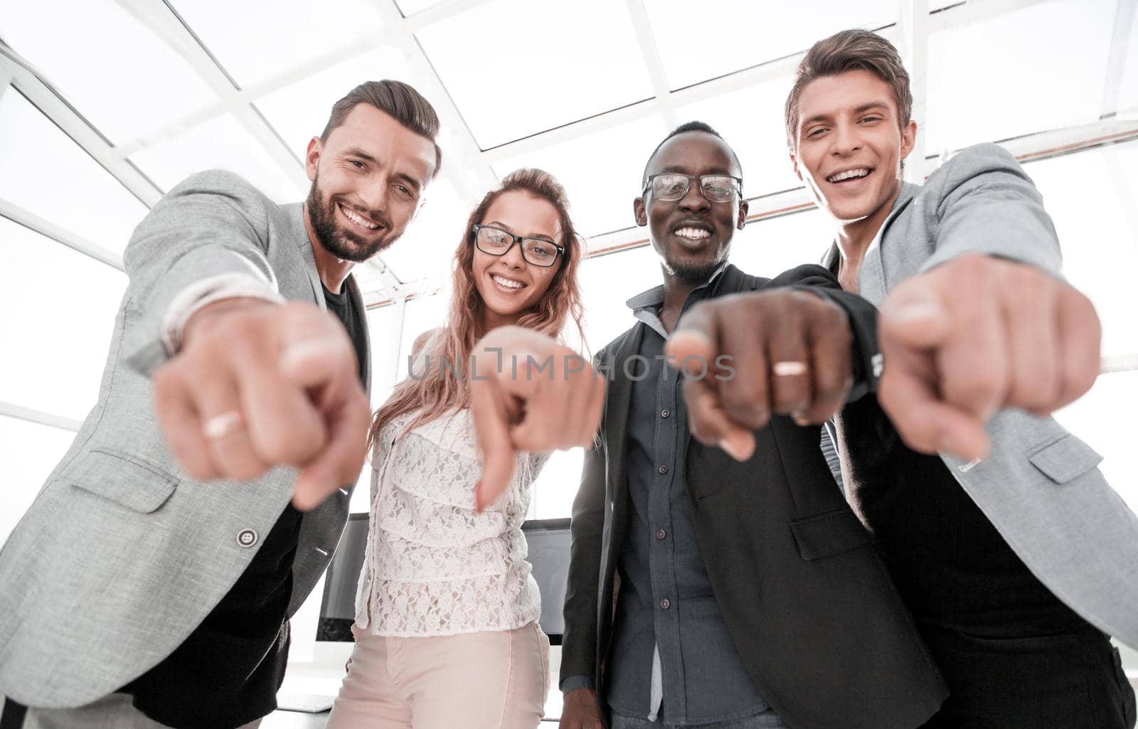 multinational business team points their fingers at you by asdf