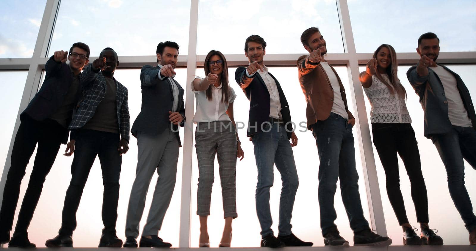 group of young business people pointing at you . the concept of choice