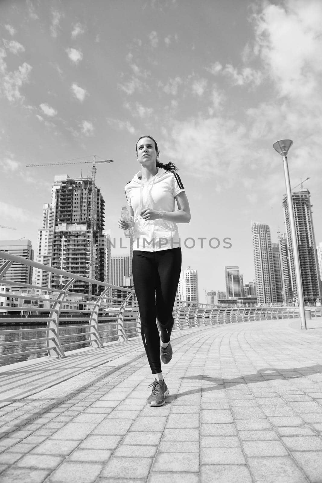 woman jogging at morning by dotshock