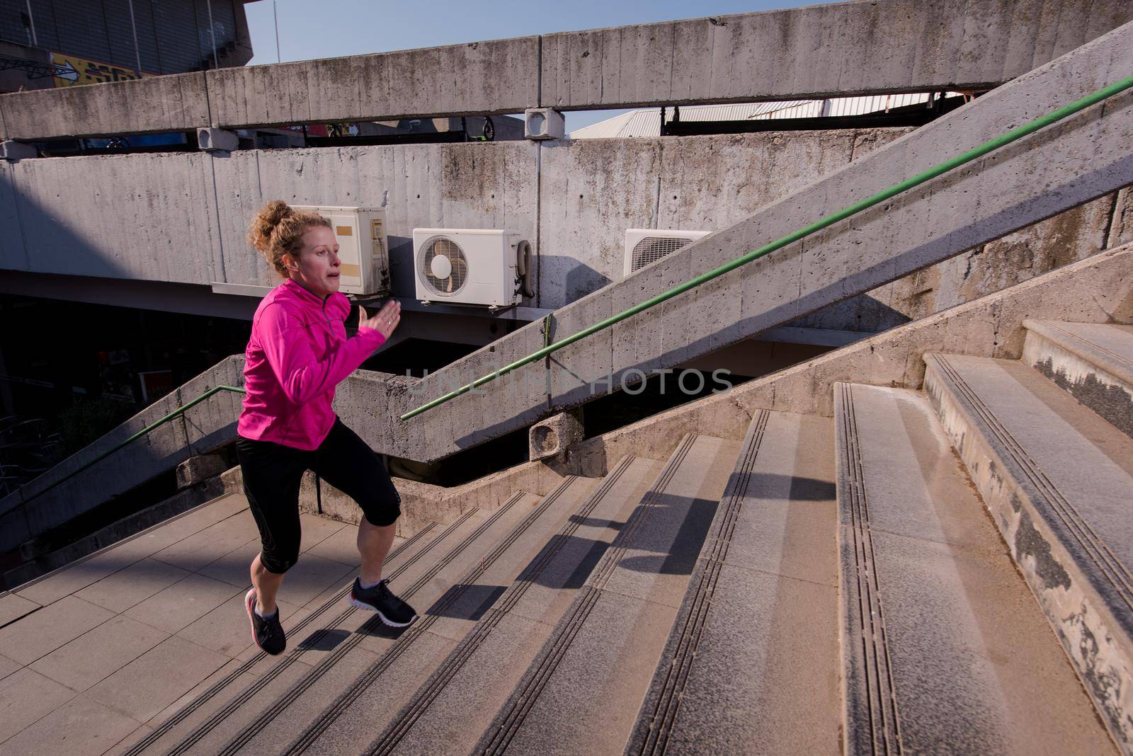 woman jogging on  steps by dotshock