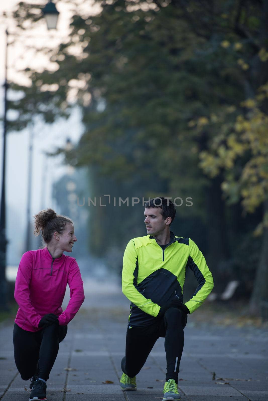 couple warming up before jogging by dotshock