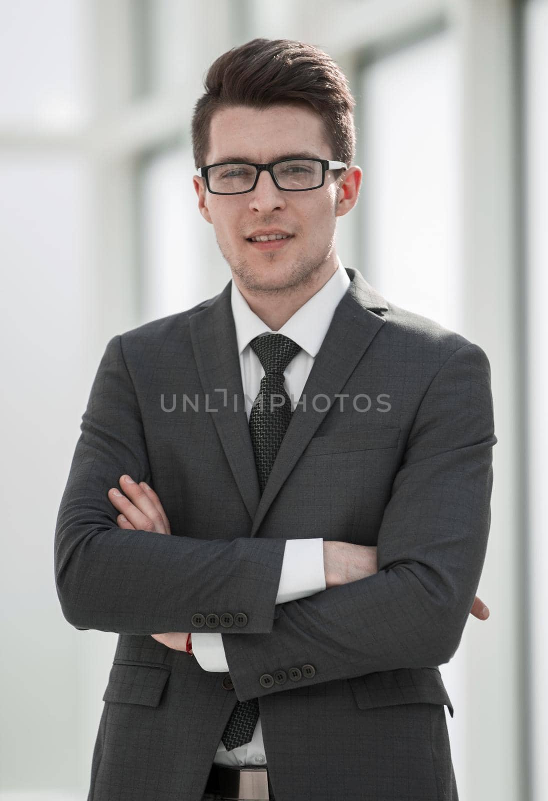 portrait of a successful young businessman by asdf