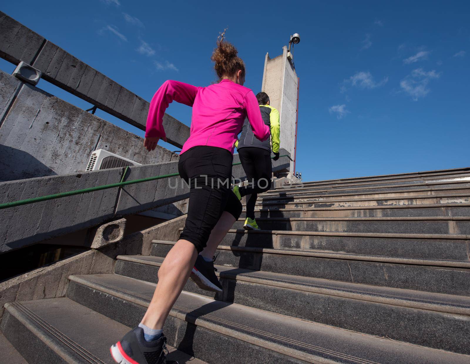 woman jogging on  steps by dotshock