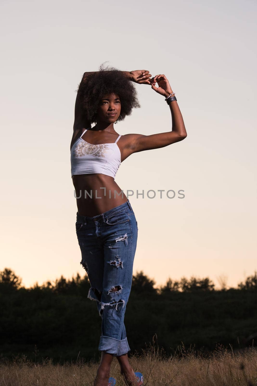 young black woman in nature by dotshock