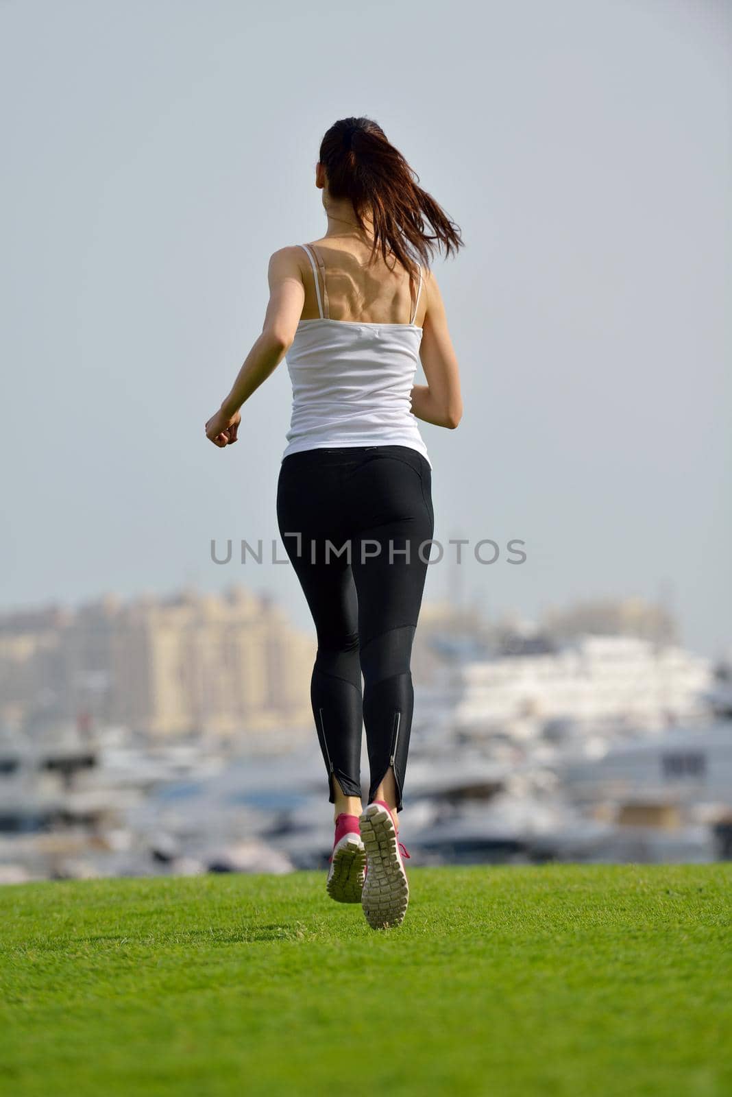 woman jogging at morning by dotshock