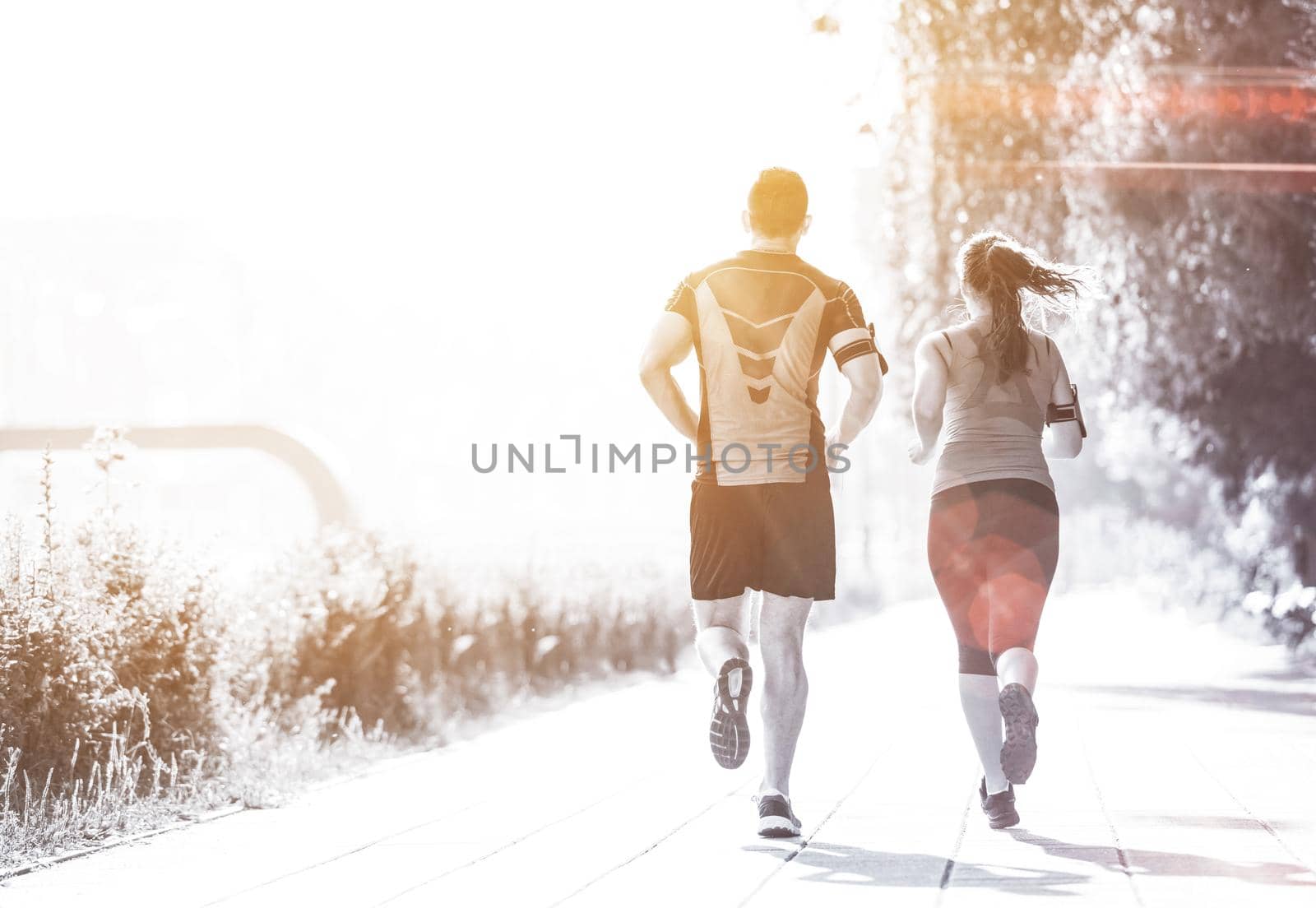young couple jogging  in the city by dotshock