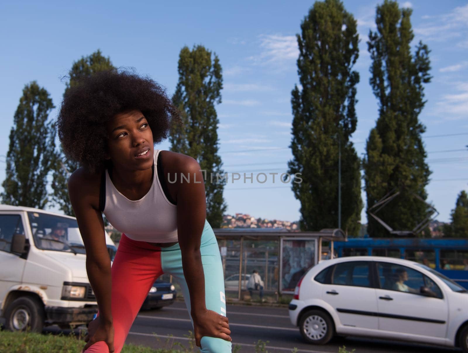 Portrait of sporty young african american woman running outdoors by dotshock