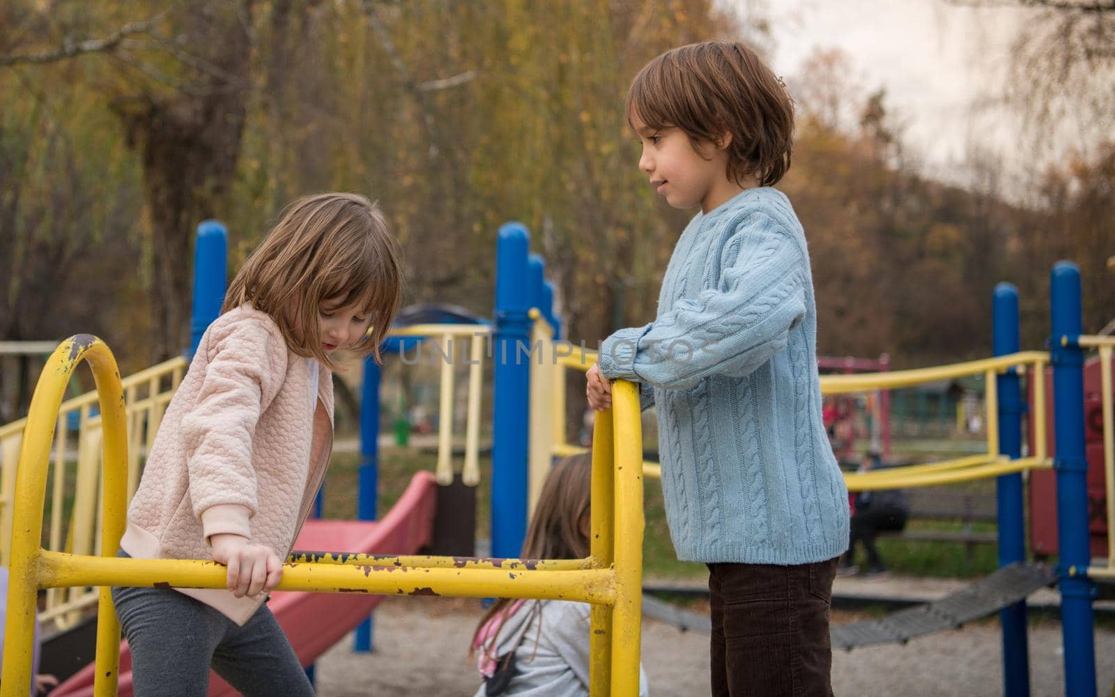 kids in park playground by dotshock