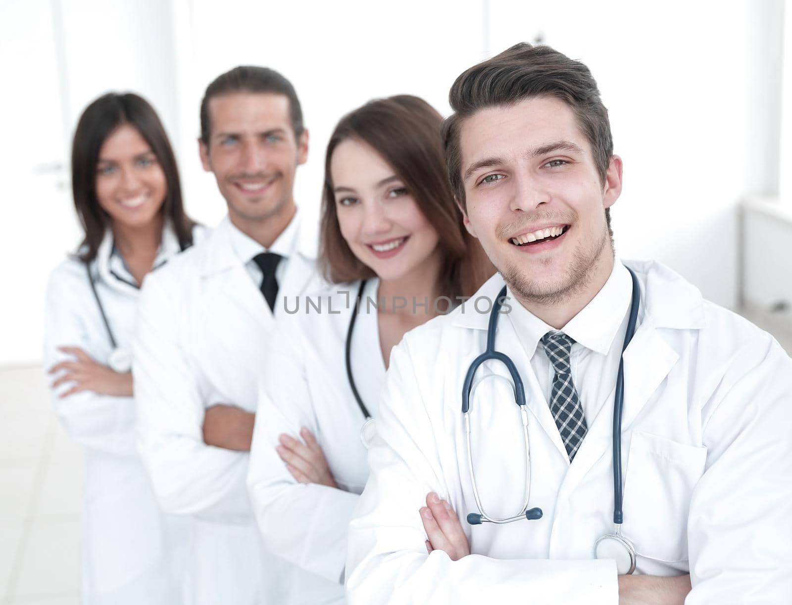 Portrait of confident happy group of doctors by asdf
