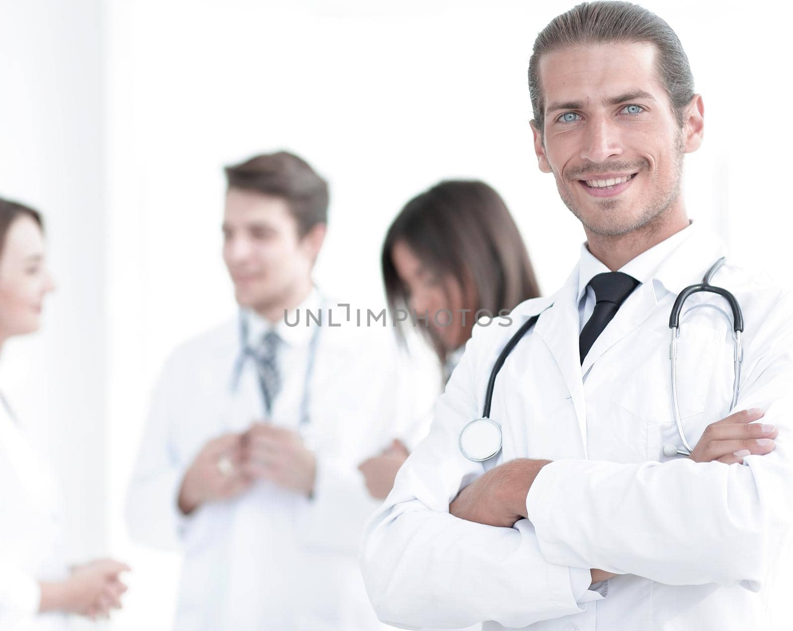 smiling doctor therapist on blurred background. by asdf