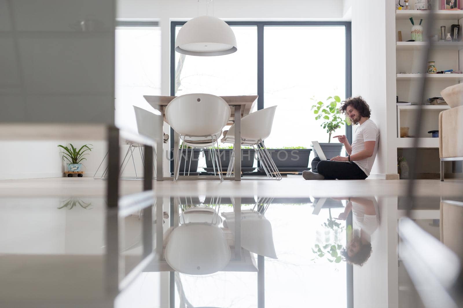 Real man Using laptop on the floor At Home  Enjoying Relaxing