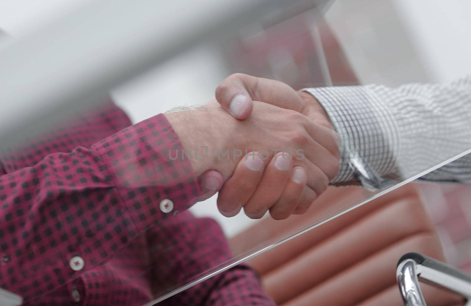 closeup.handshake colleagues by asdf