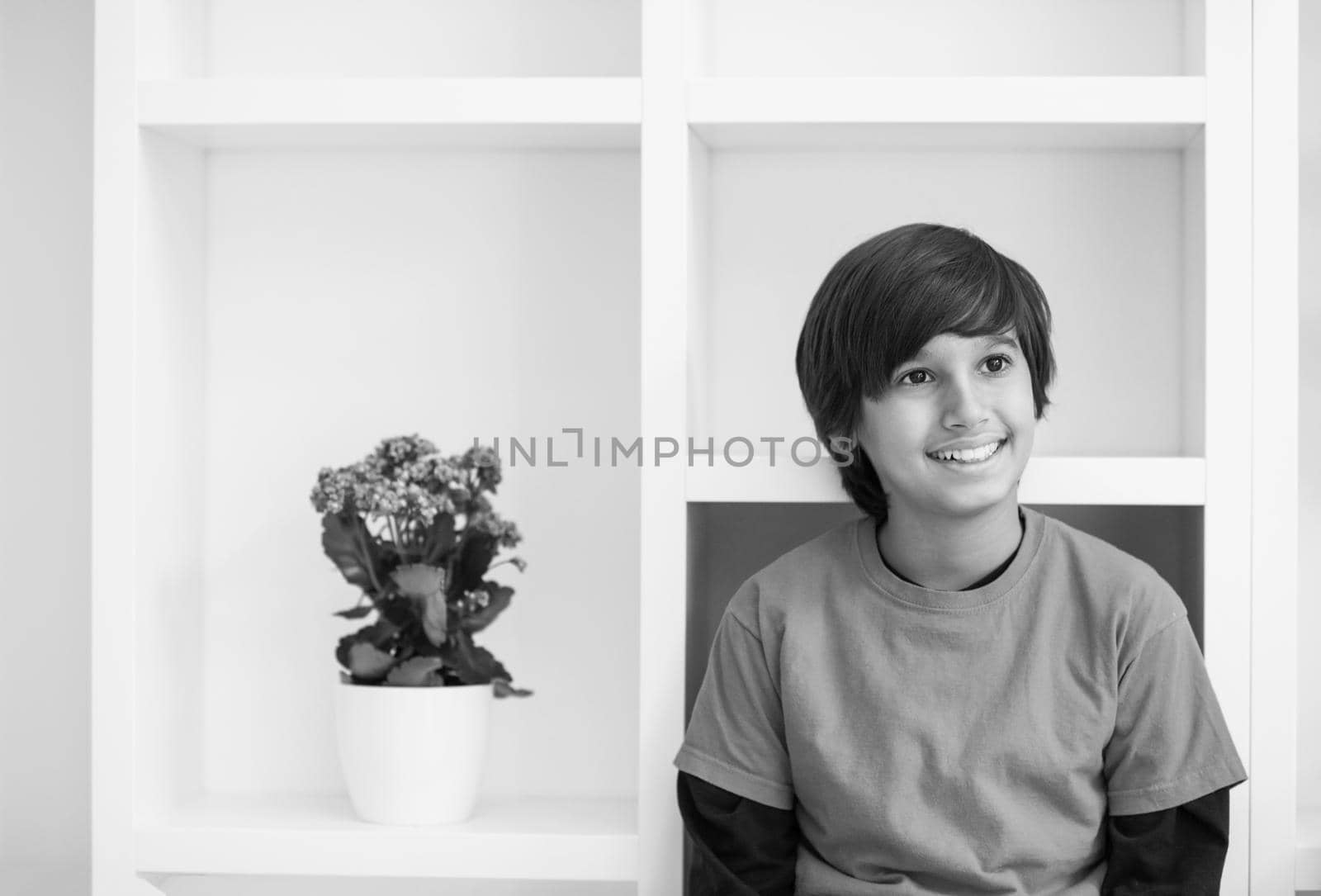 young boy posing on a shelf by dotshock