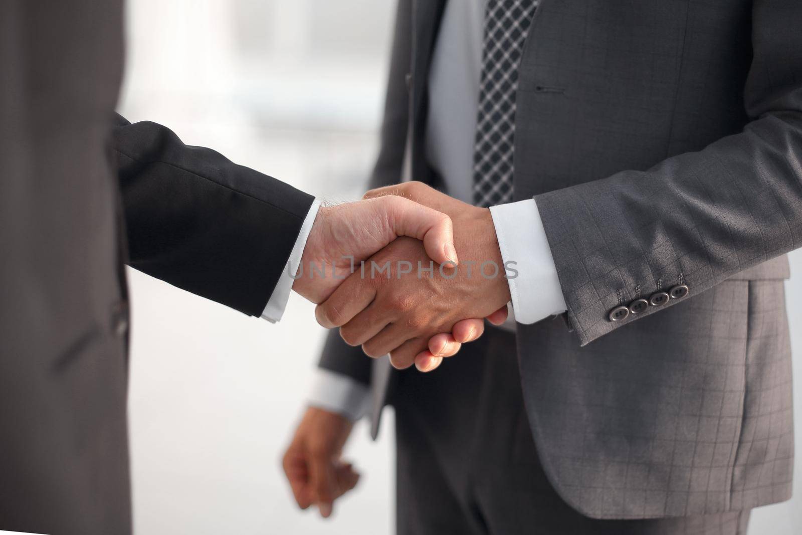 close up. handshake business partners by asdf