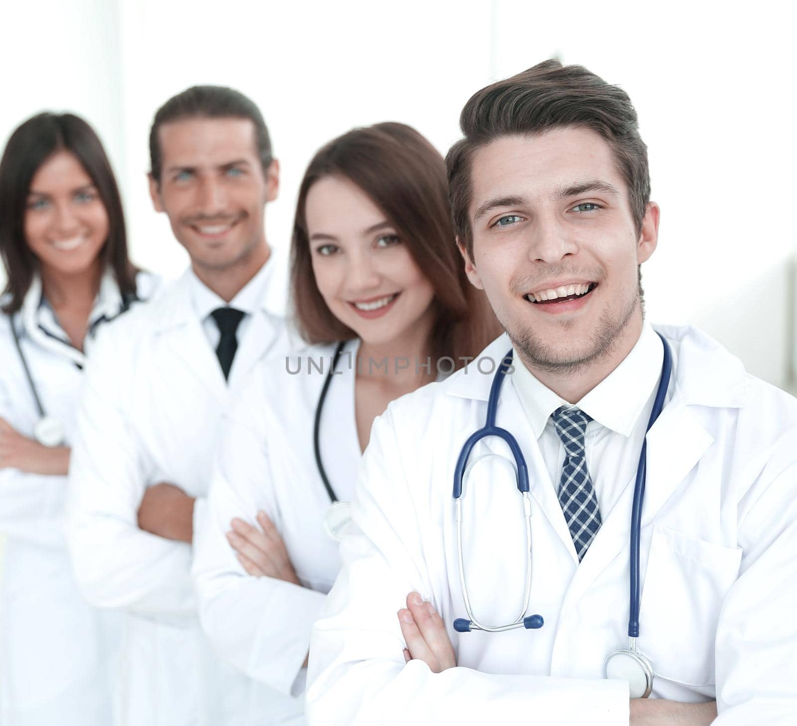 confident happy group of doctors standing at the medical officce