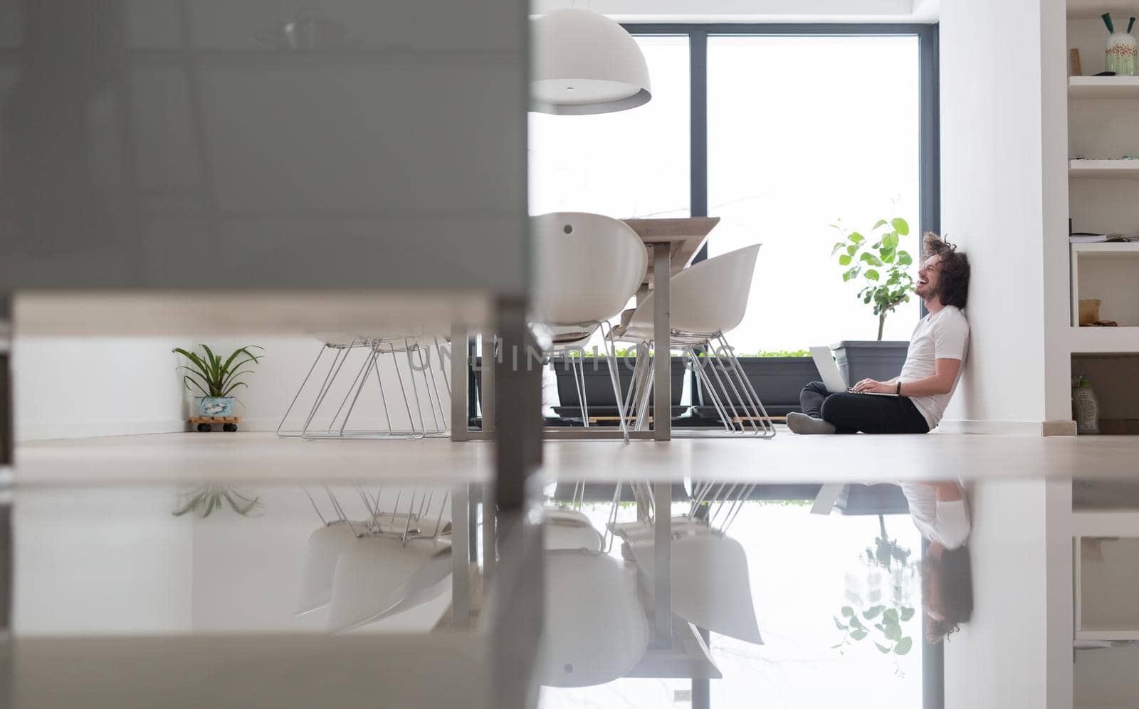 Real man Using laptop on the floor At Home  Enjoying Relaxing