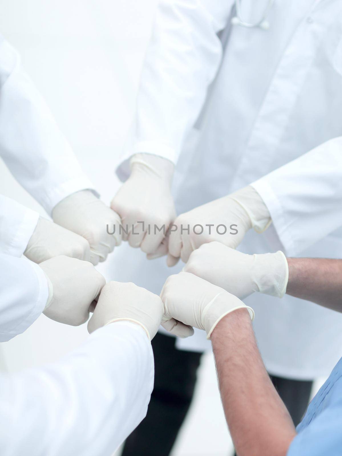 Doctors and nurses coordinate hands. by asdf