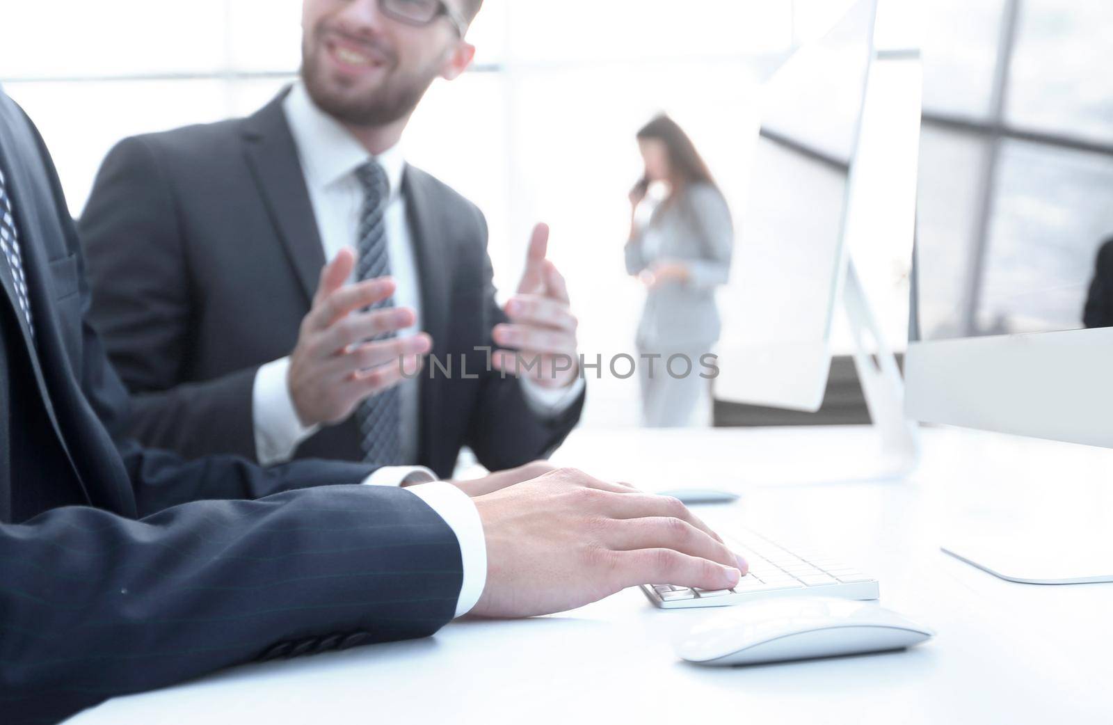 business colleagues sitting at their Desk on blurred background office