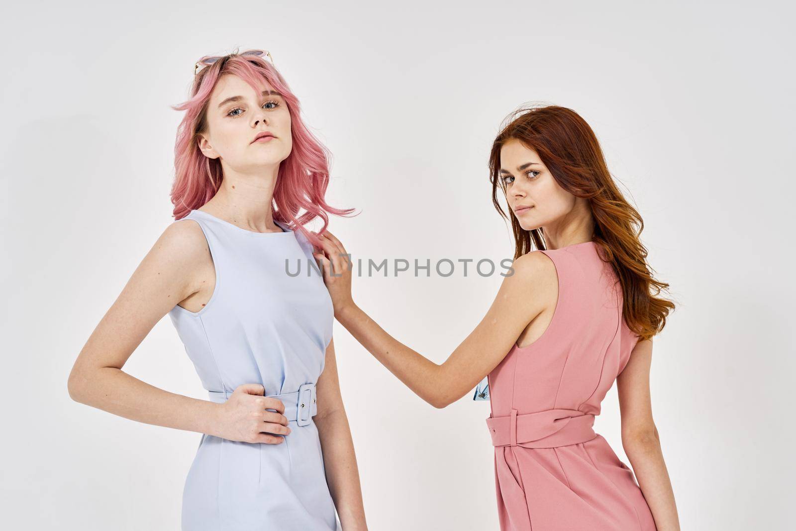 two girlfriends stand side by side posing glamor glamor luxury by Vichizh