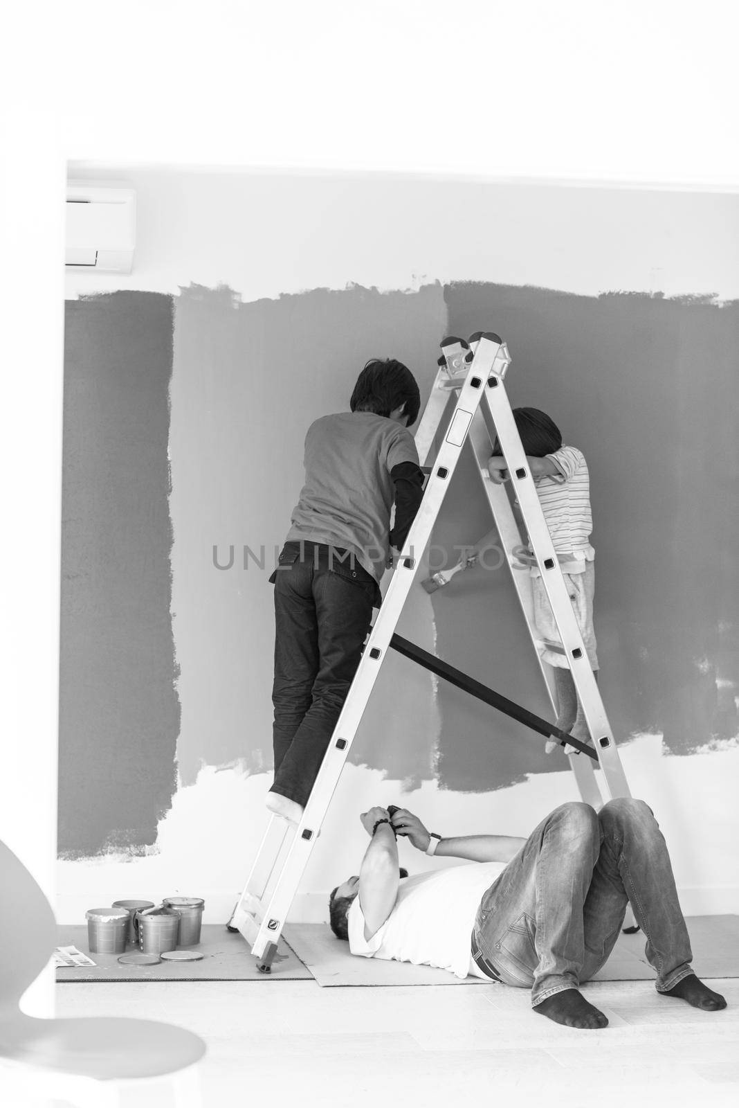 boys painting wall by dotshock