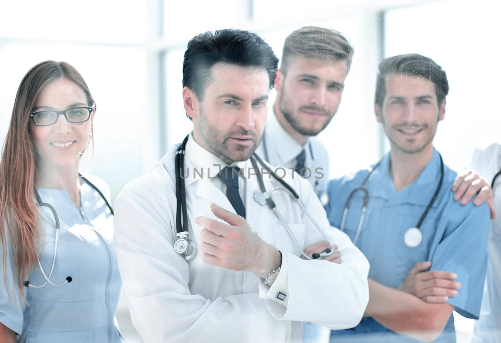 group of doctors standing in the meeting room by asdf