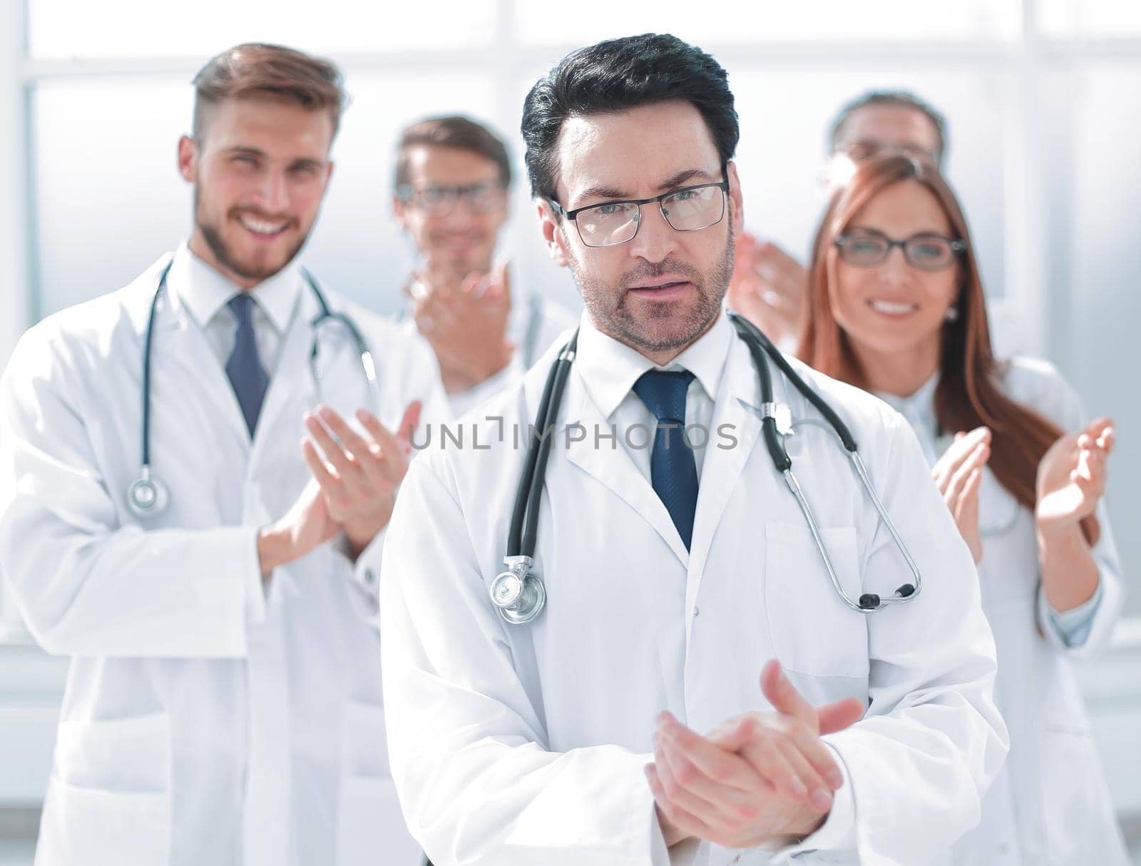 successful doctor, accepting congratulations from colleagues .the concept of success