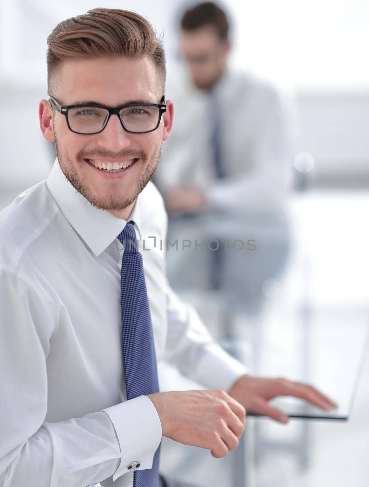 close up.portrait of smiling businessman in the workplace by asdf