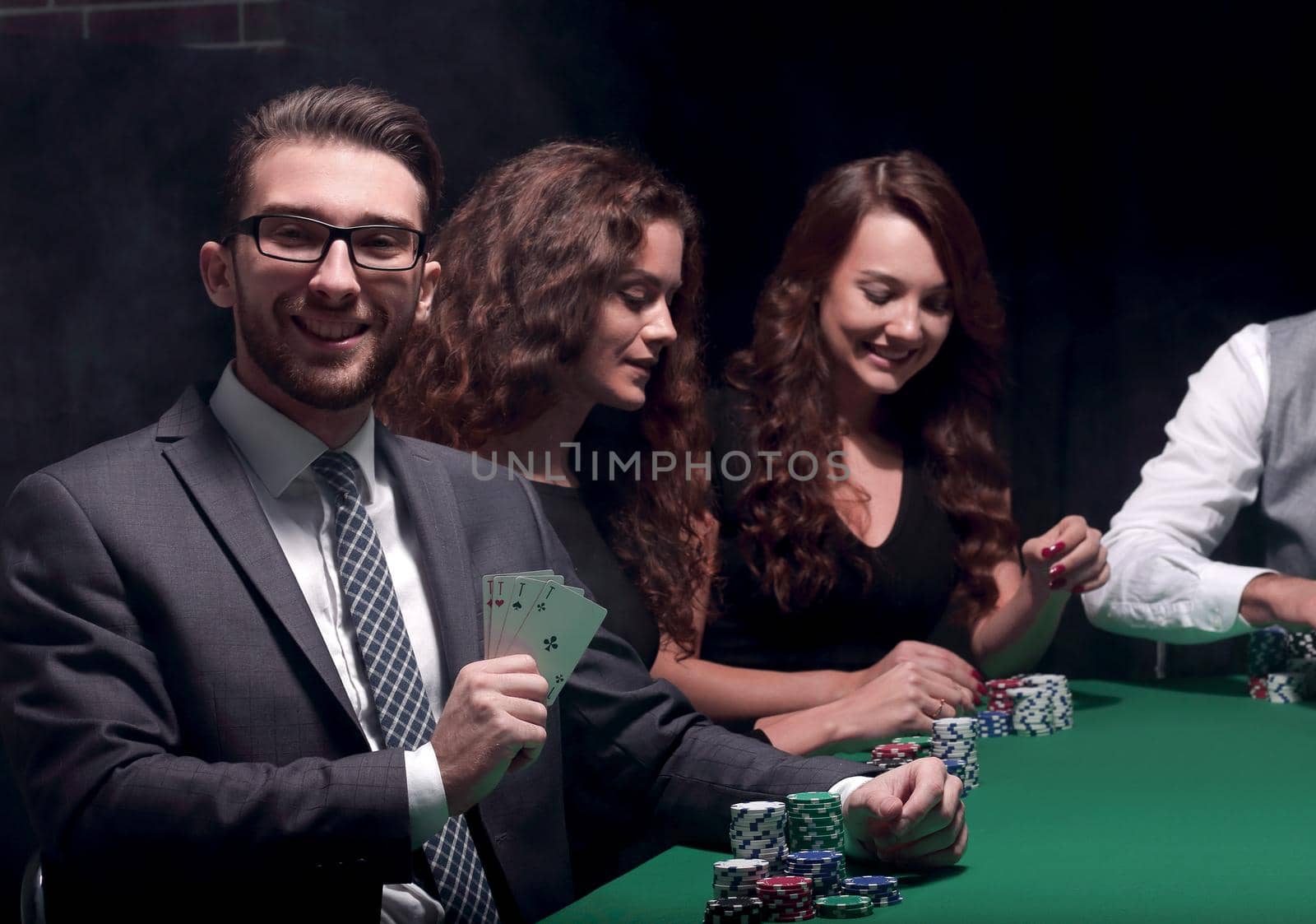 businessman showing four aces by asdf