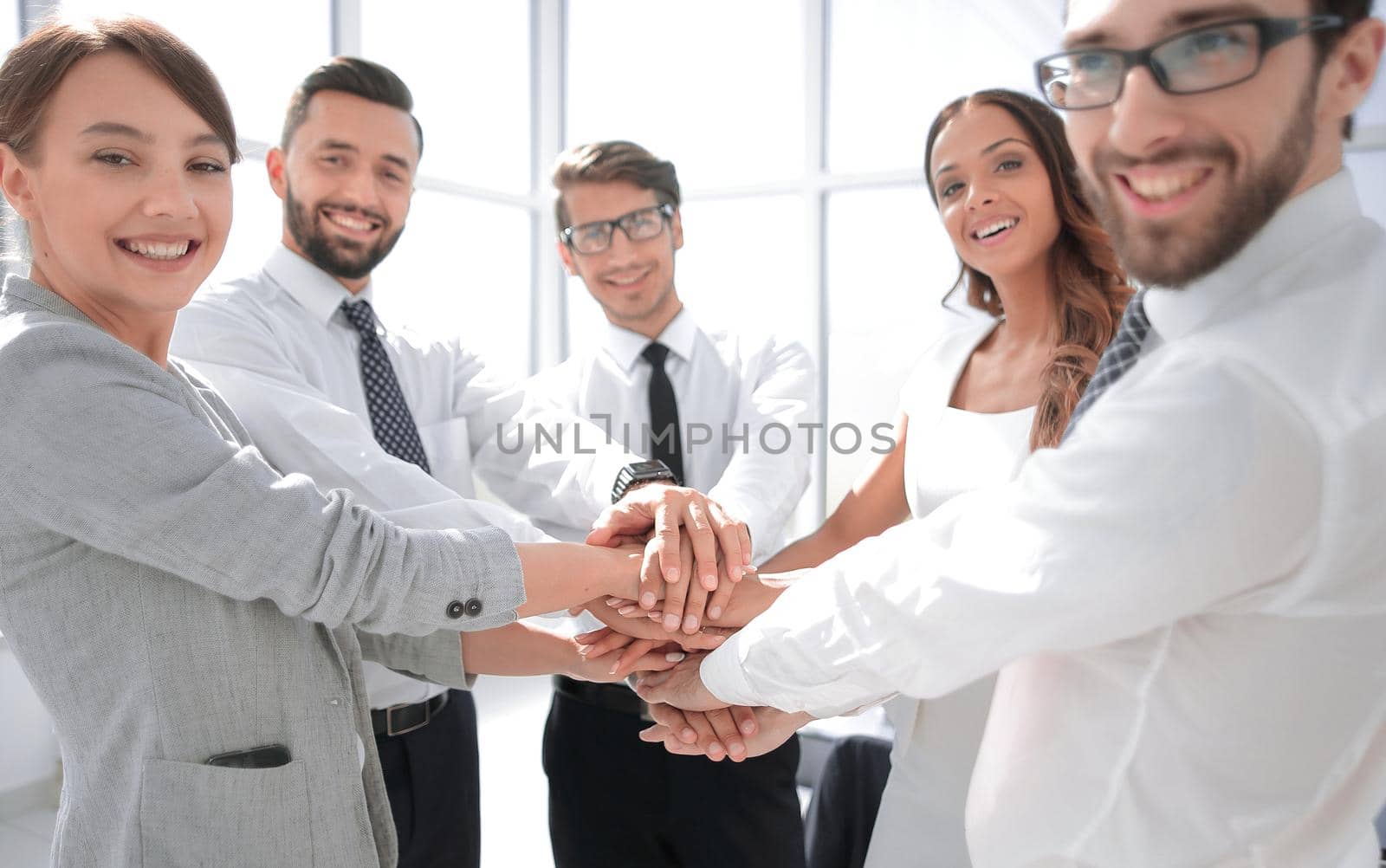 business team showing their unity. the concept of teamwork