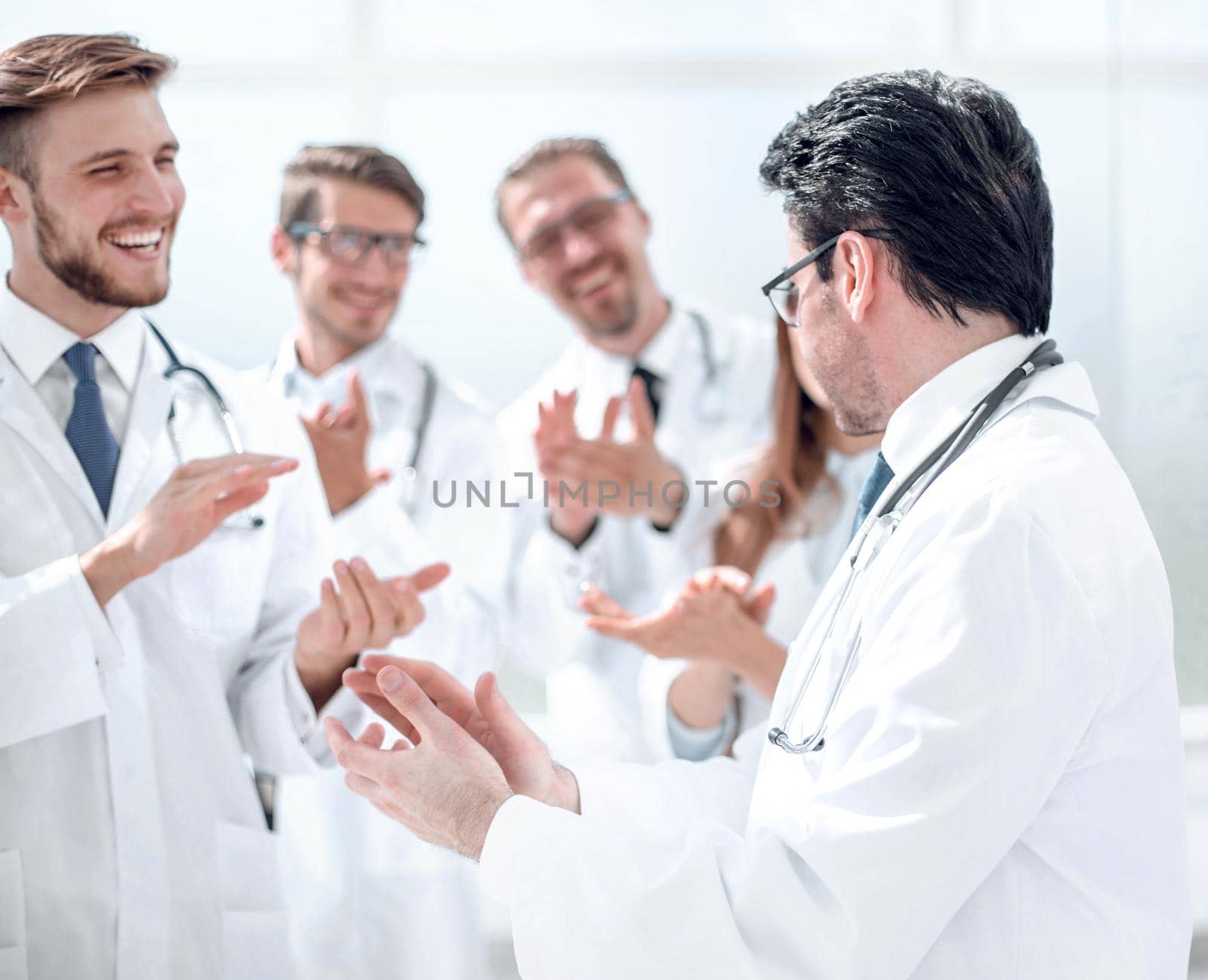 group of doctors applauding each other.the concept of success